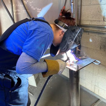 a female welding